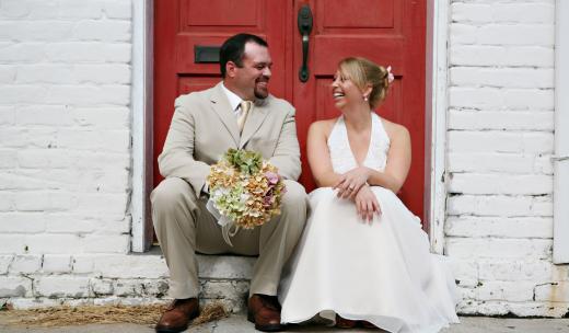 A couple sits in a doorway in Savannah, Georgia. A couple sits in a doorway in Savannah, Georgia.
