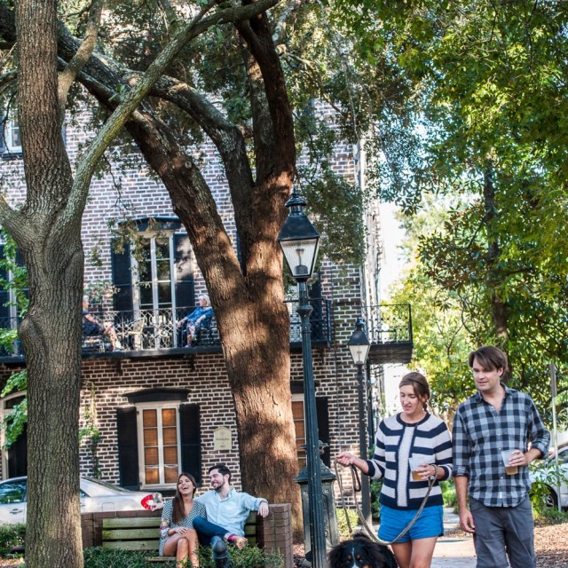 Couple with dog near Mercer-Williams House