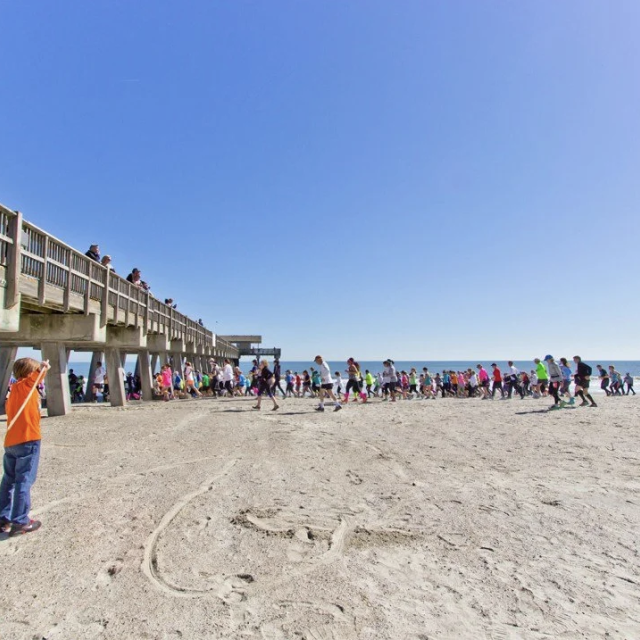 Runners on Tybee Island Beach during the YMCA Critz Tybee Run Fest