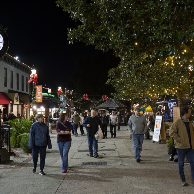 People walking through City Market during the holiday season