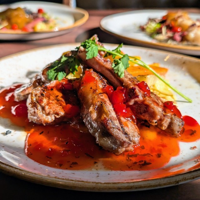 A plate of food sitting on a table.