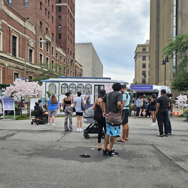 people exploring an outdoor mobile setup