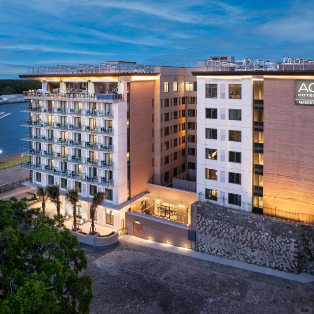 An evening drone image of a hotel.