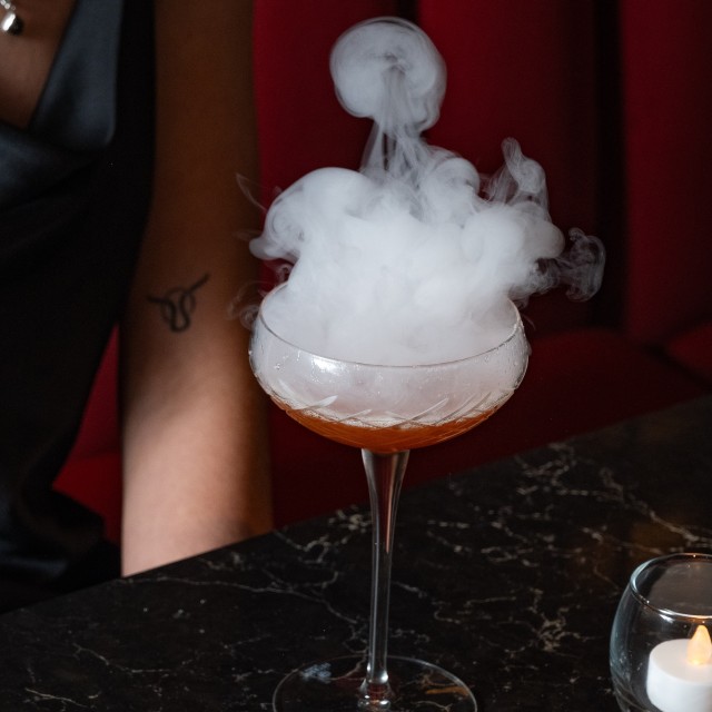 Smoke coming from a cocktail drink.