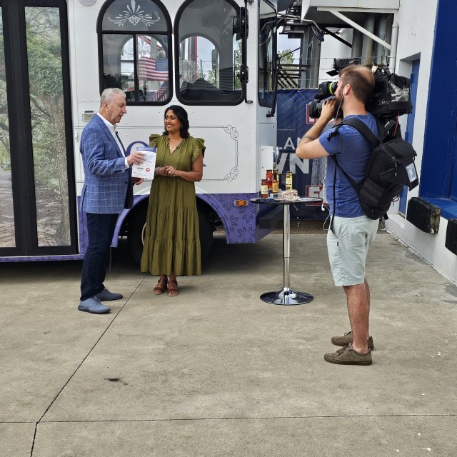 A woman doing a news interview.