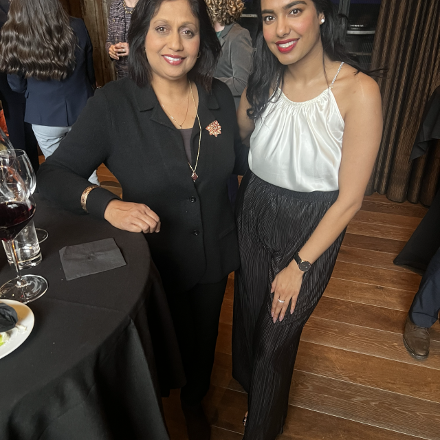 Two ladies posing for a picture.