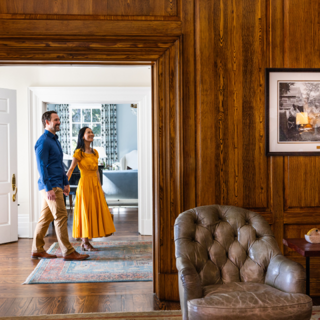 A couple walking through a potential home.
