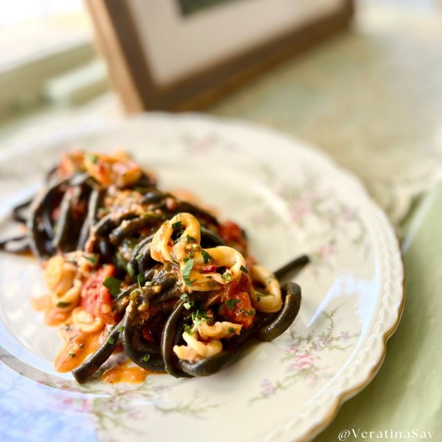 A plate of pasta served on fine China.