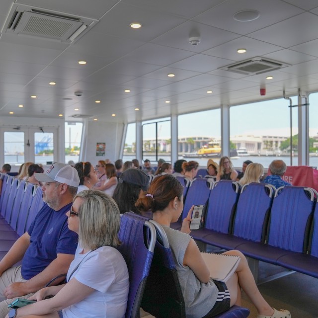 The interior seating of a large capacity boat ferry.