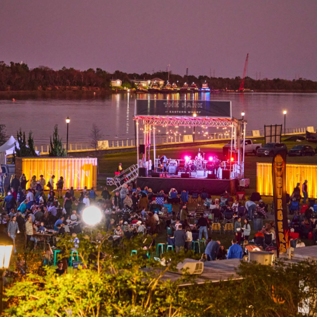An outdoor food truck festival next to the Savannah River.
