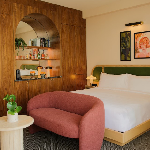A modern hotel guest room with 60’s inspired decor.