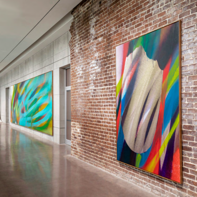 Large canvas prints on display in a gallery.