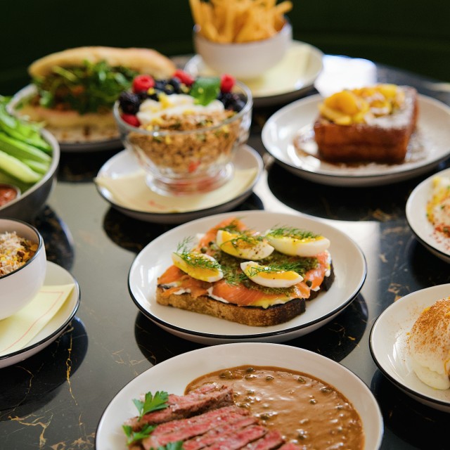 Brunch spread with steak, salmon toast and berry parfait.