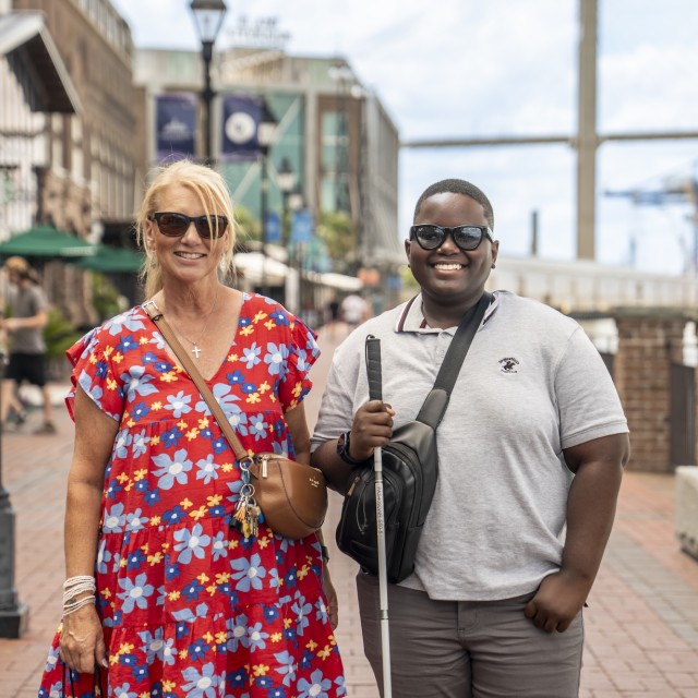 Blind walkers together on Savannah’s River Street.