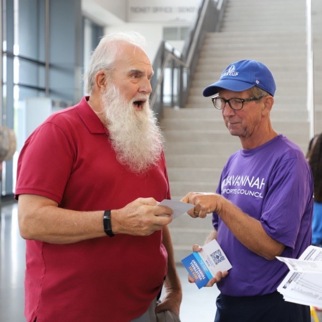 man giving other man information