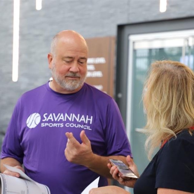 man giving woman information