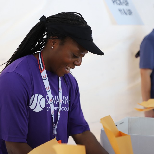 women handing out registrations
