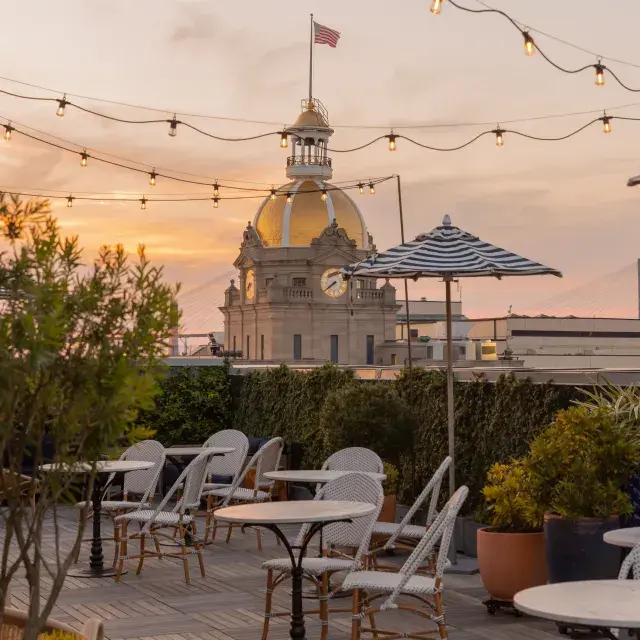 Pendant Terrace and Bar rooftop at sunset.