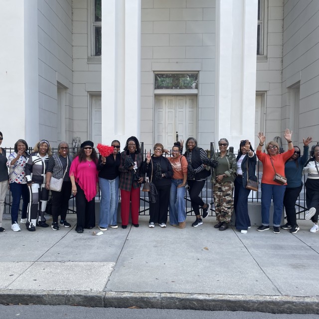 Group posing in front of a historic church in Savannah.