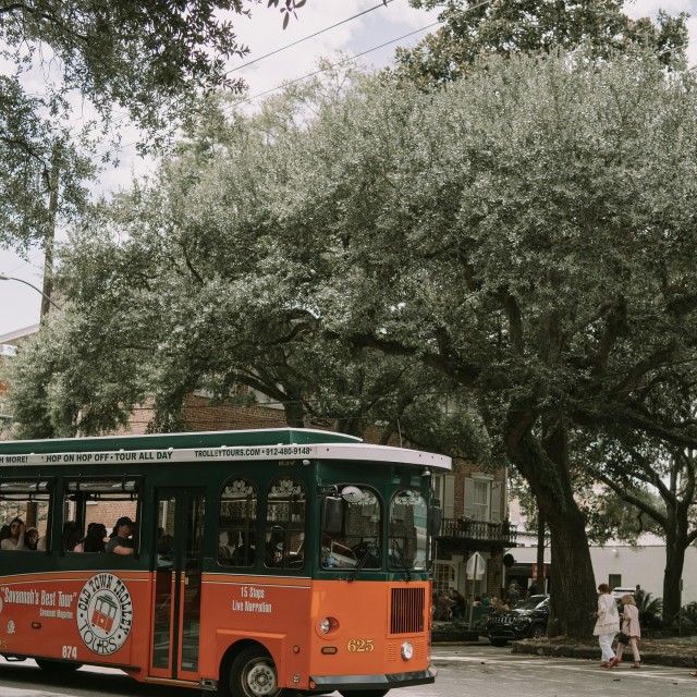 Old Town Trolley Tours orange and green trolley in Savannah, GA.