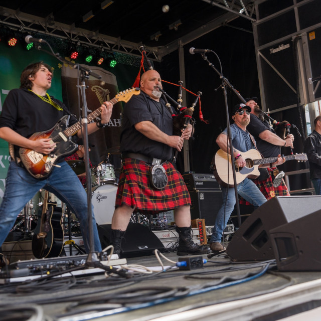 A live band plays on stage during St. Patrick’s Day in Savannah’s City Market.