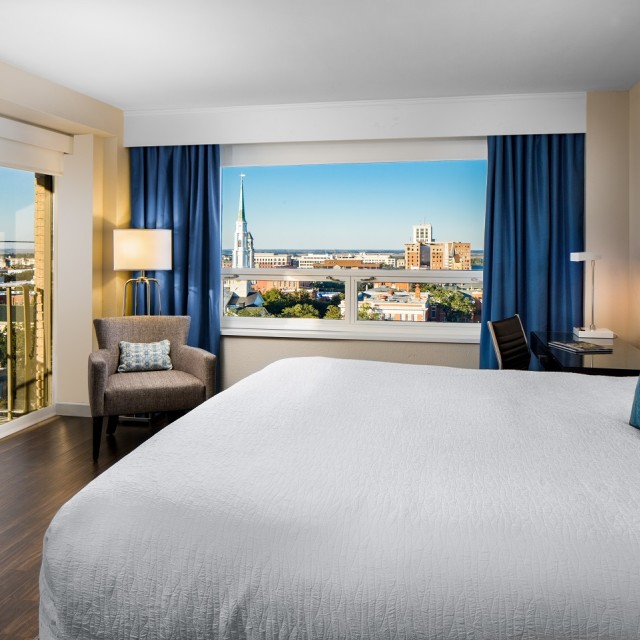 A room with a king bed at The Desoto Savannah.