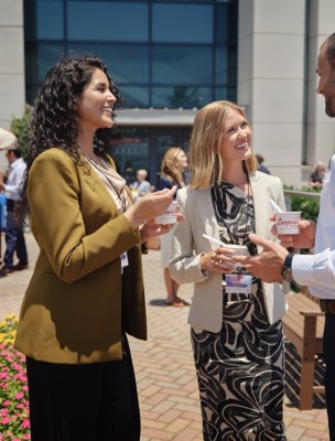 attendees outside convention center talking and eating ice cream