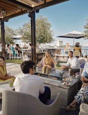 large group on rooftop overlooking Savannah River