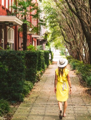 Solo traveler walking the street in Savannah, Georgia.