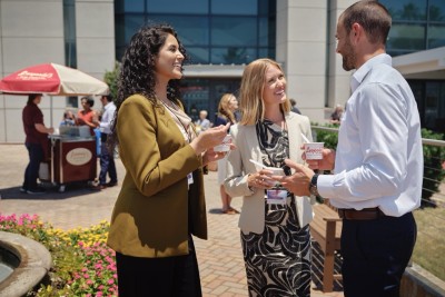 attendees outside convention center talking and eating ice cream