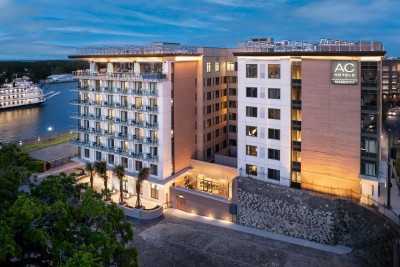 An evening drone image of a hotel.