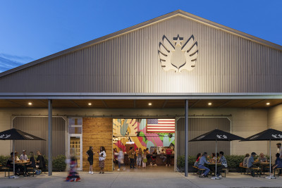 A nighttime exterior shot of Service Brewing in Savannah, GA.