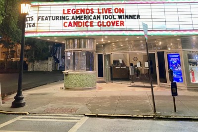 The Historic Savannah Theatre marquee lights up the Savannah skyline.