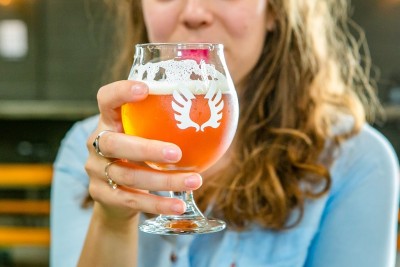 Service-Brewing-woman-drinking-beer.jpg