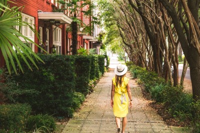 Solo traveler walking the street in Savannah, Georgia.