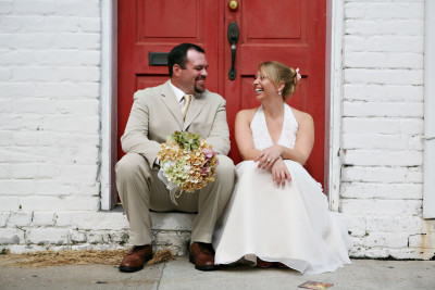 A couple sits in a doorway in Savannah, Georgia.