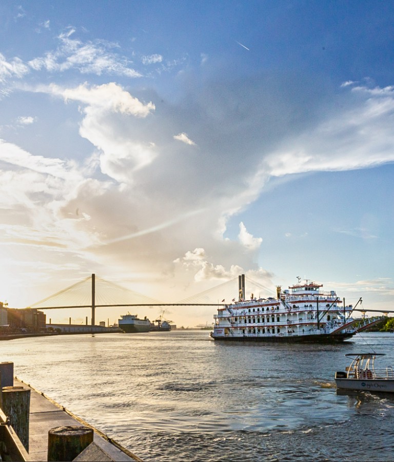 River Street at sunset with a riverboat on the water