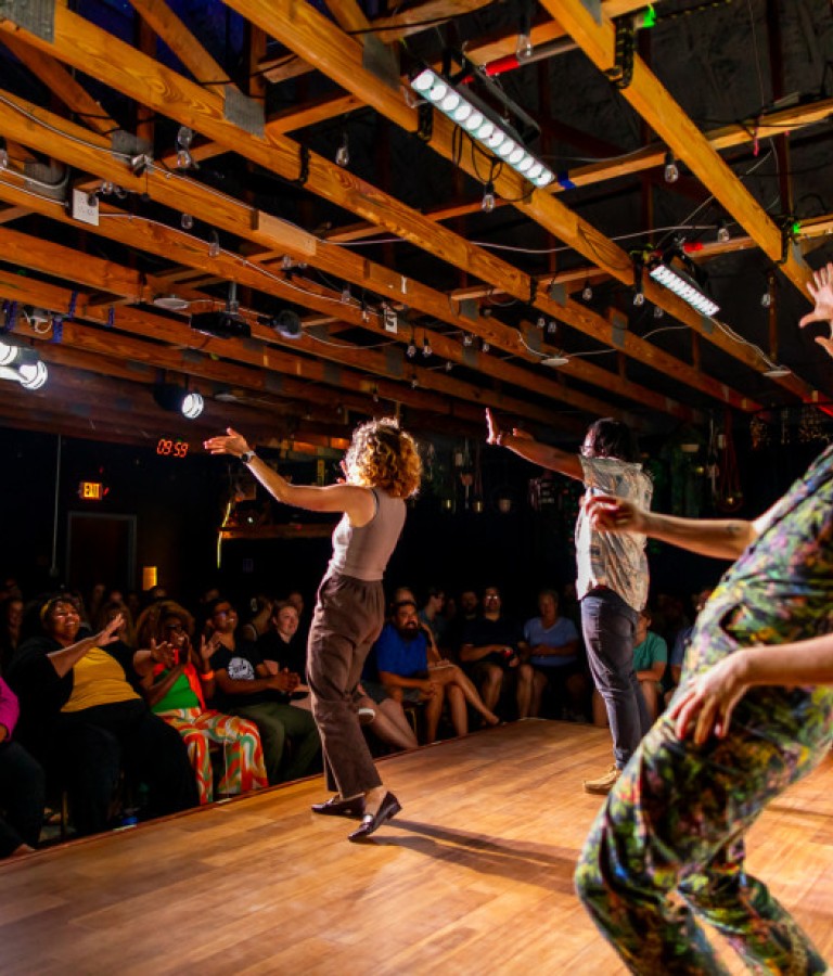 Comedic entertainers on stage.