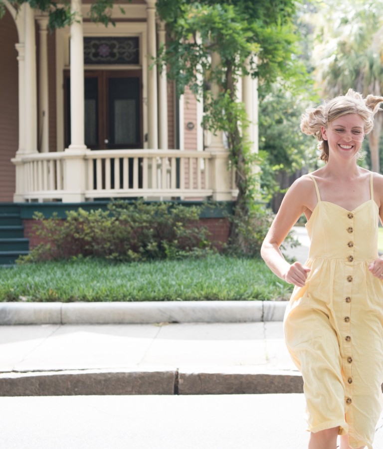 Two friends running through Savannah’s Victorian District neighborhood.