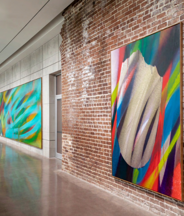 Large canvas prints on display in a gallery.