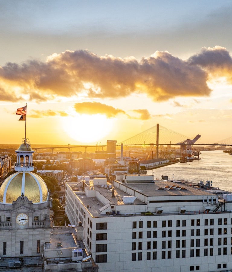 An aerial view of downtown Savannah, GA at sunset.