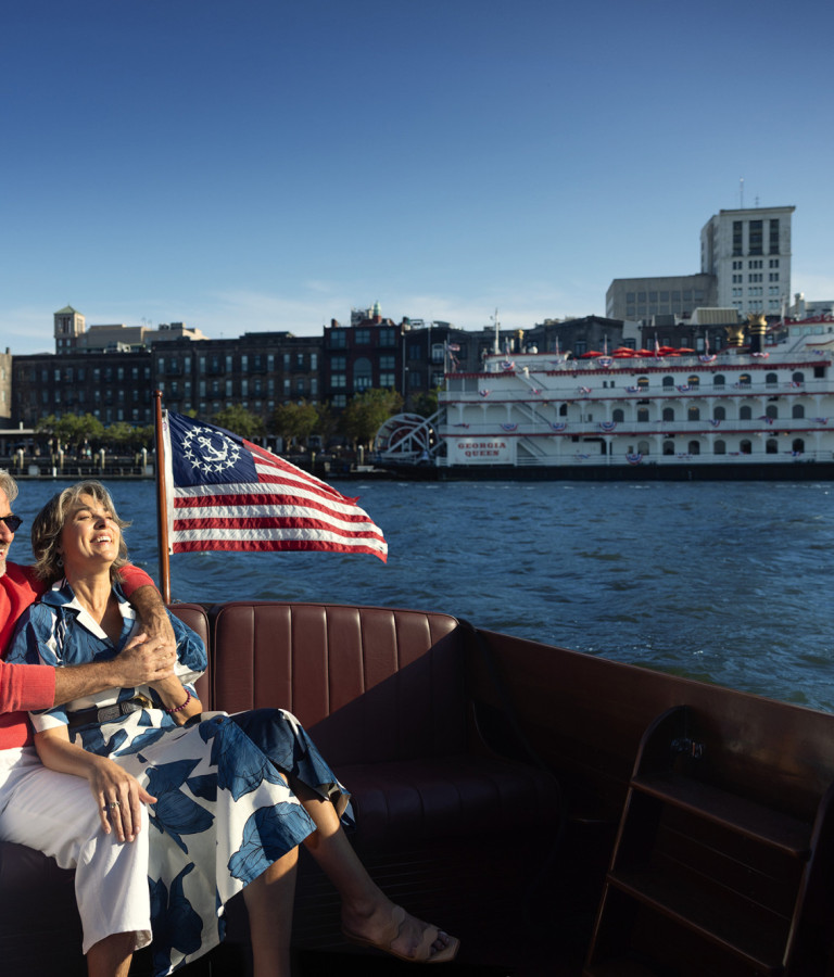 Couple enjoying a boat ride along the Savannah River.