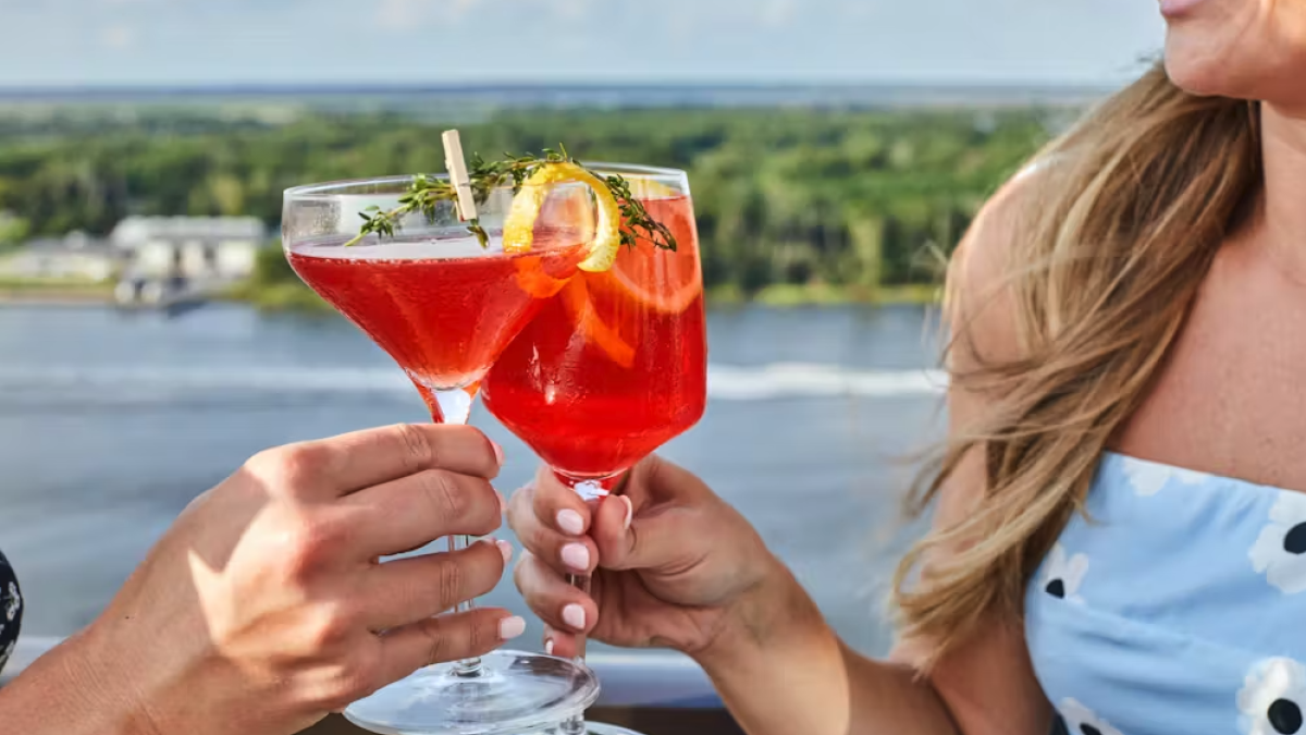 Bar Julian; couple cheers with drinks