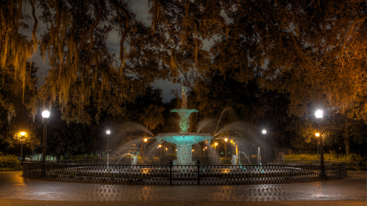 An eerie view of Forsyth Park at night