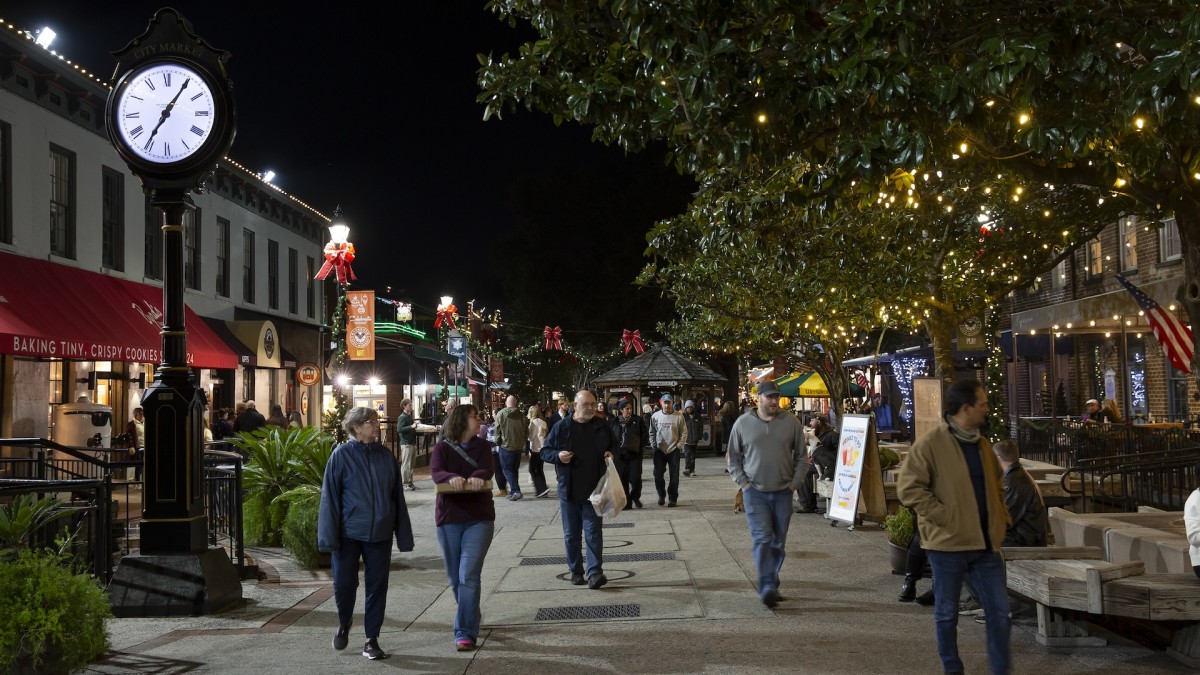 People walking through City Market during the holiday season