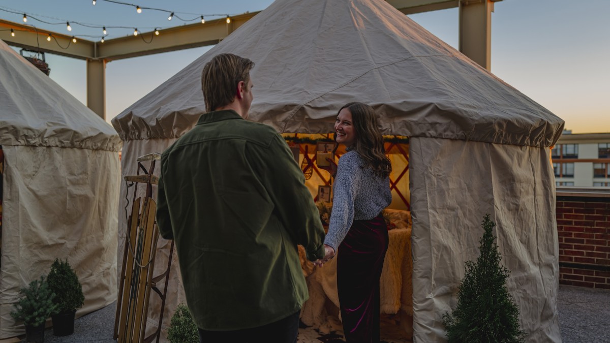 Alida Hotel’s Alpine Village at The Lost Square - couple holding hands