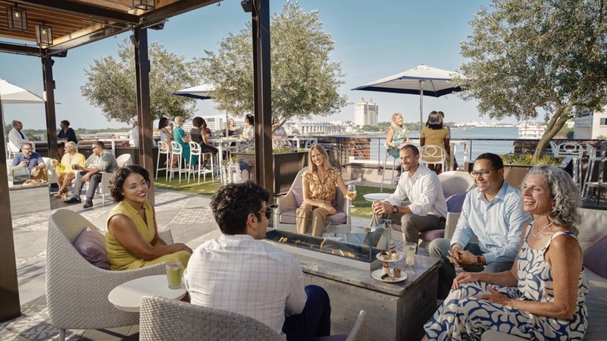 large group on rooftop overlooking Savannah River
