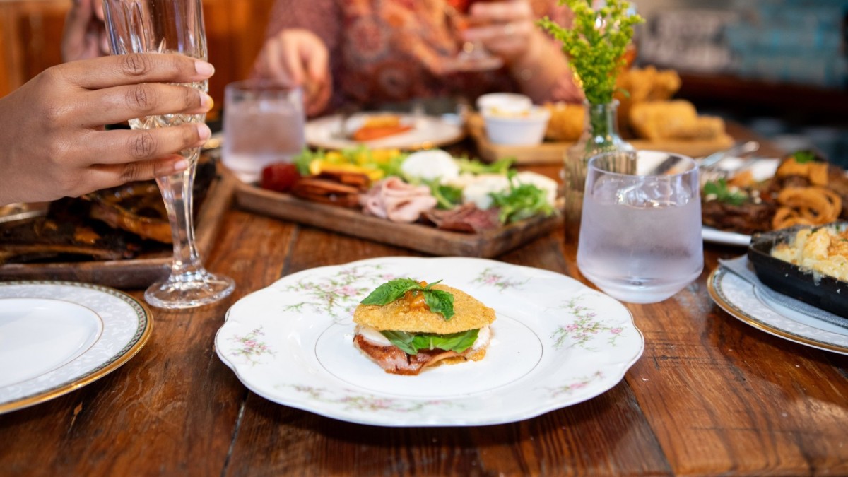 A dining table with plates of food.