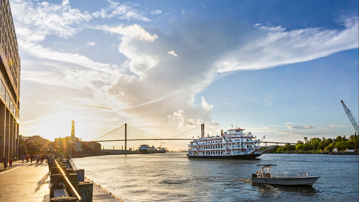 River Street at sunset with a riverboat on the water