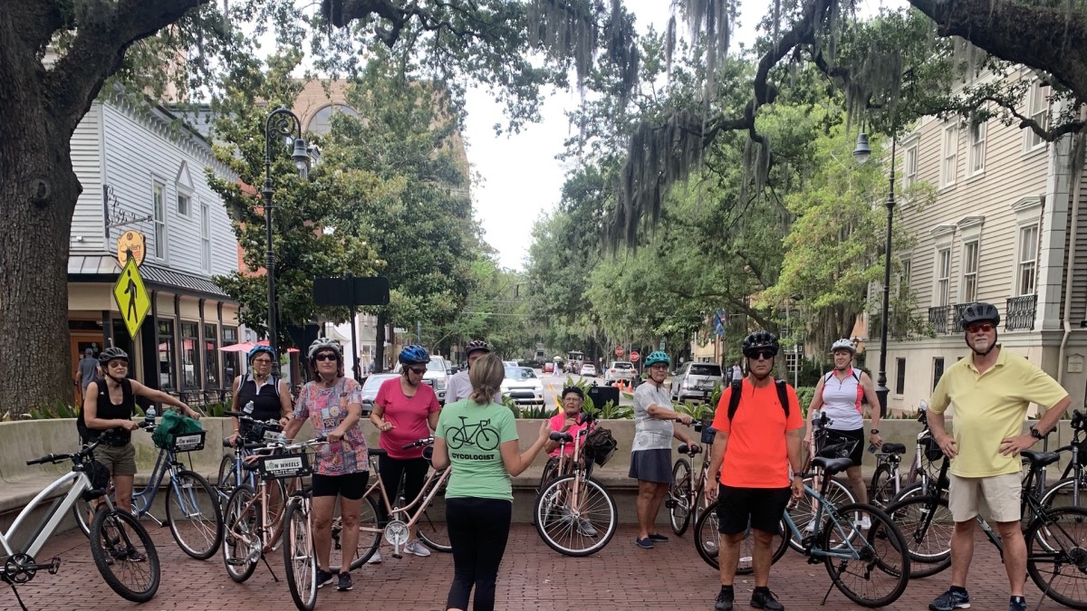 A group of people on a bike tour.